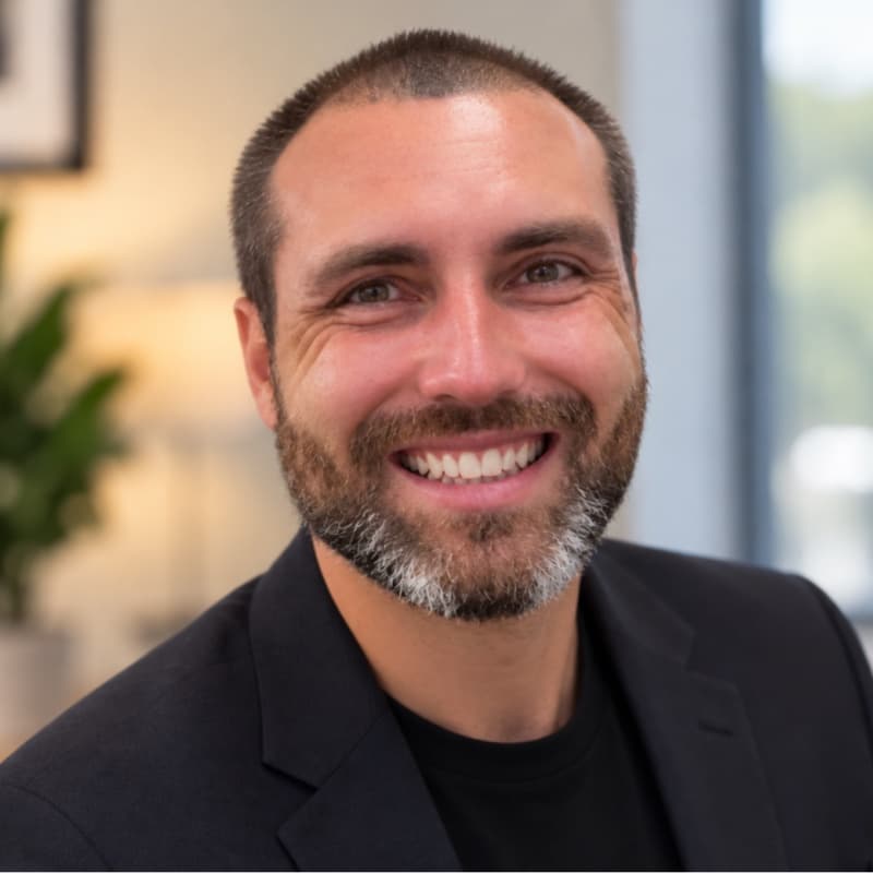 Shane Stebner, smiling, in a dark blazer